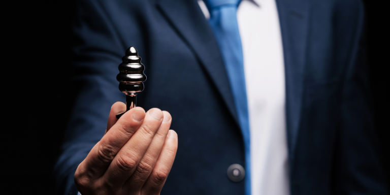 man-holding-buttplug